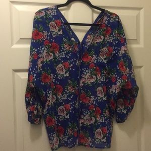 Blue floral print sheer blouse.